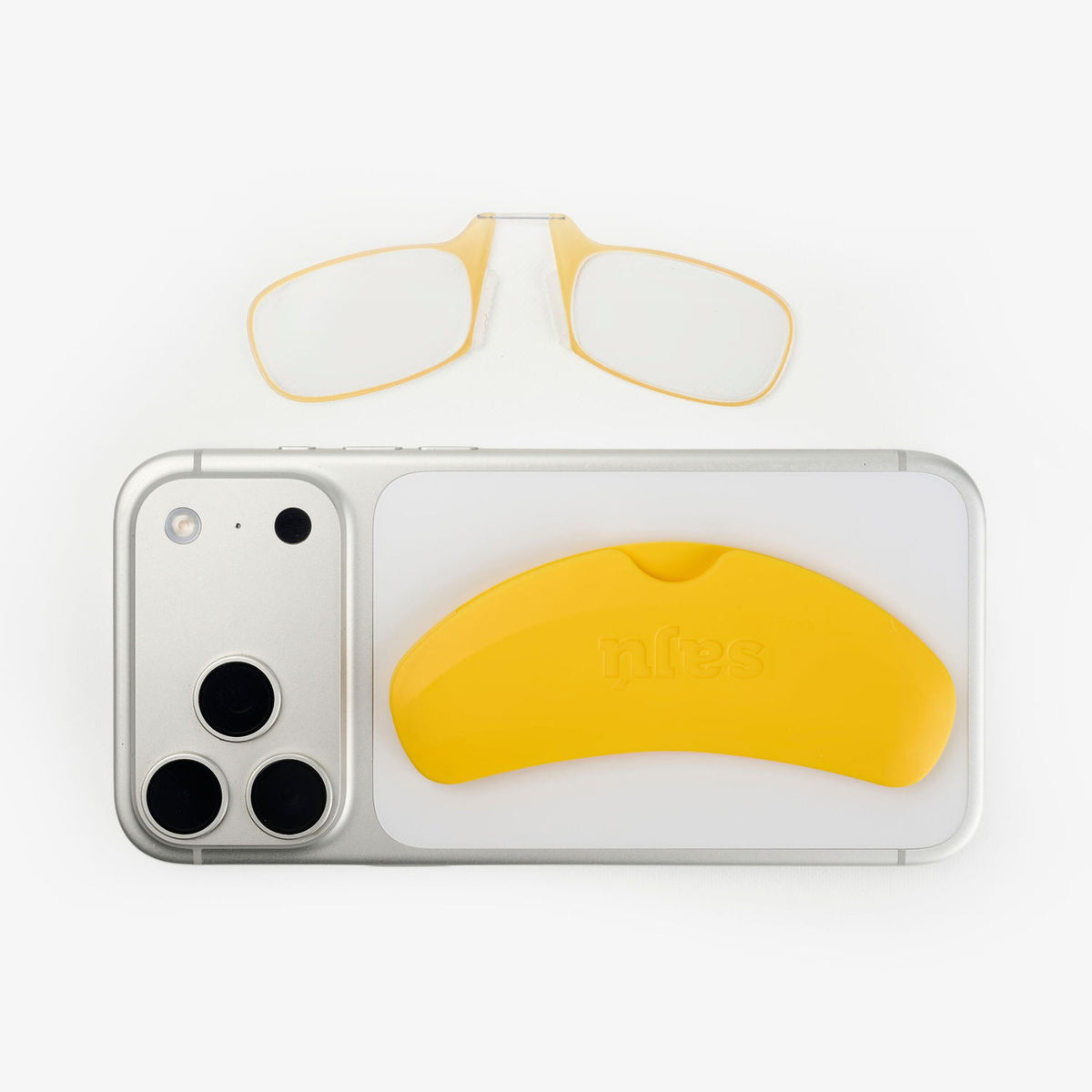 Gafas de lectura Phone Glasses Yellow junto al celular con el estuche adhesivo